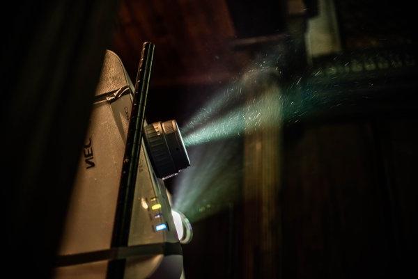 Light shining through a film projector